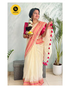 Off-White Mul Cotton Saree with medium sized pink and gold kanchi style border.
