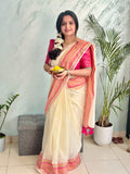 Off-White Mul Cotton Saree with medium sized pink and gold kanchi style border.