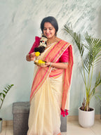 Off-White Mul Cotton Saree with medium sized pink and gold kanchi style border.
